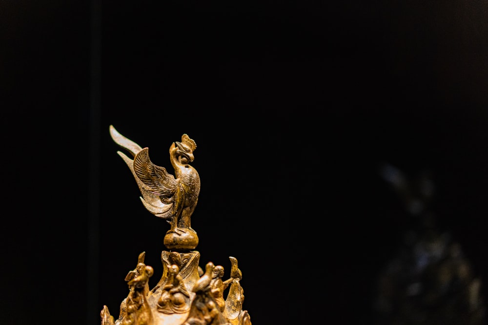 gold dragon figurine on black background