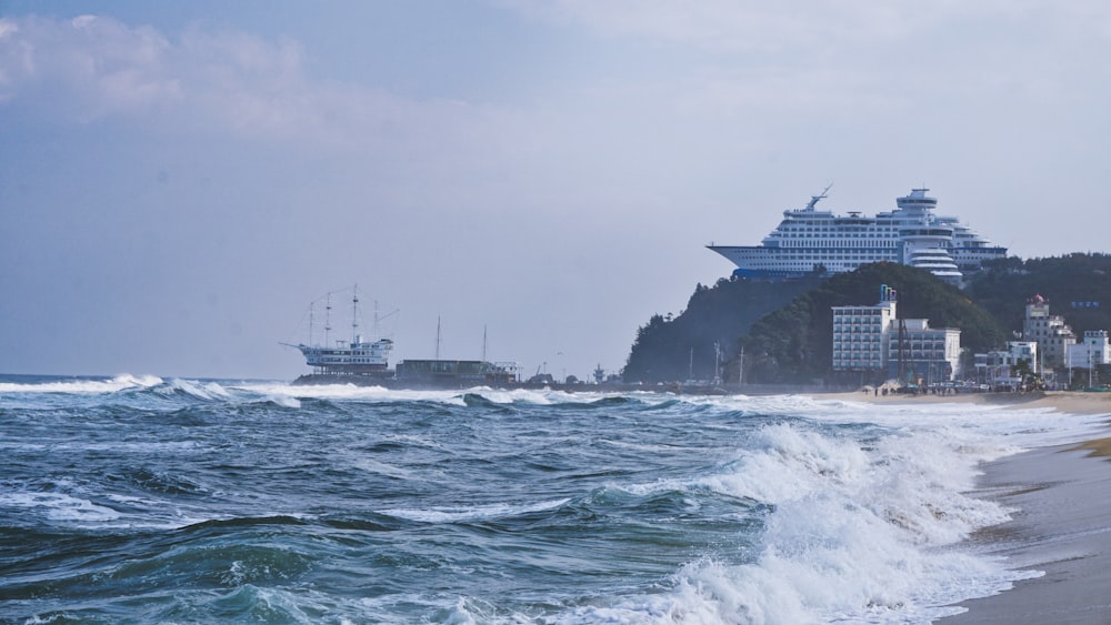 white ship on sea under white sky during daytime