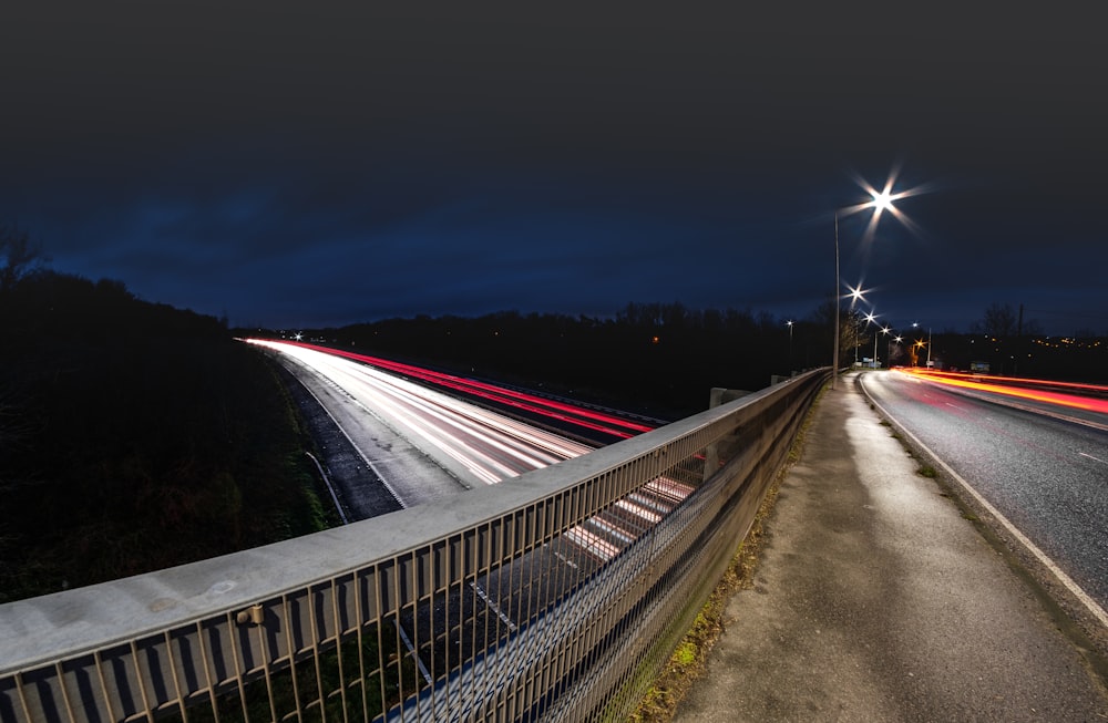 time lapse photography of cars on road during night time