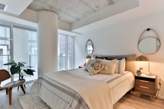 bedroom suite with white and black bed linen
