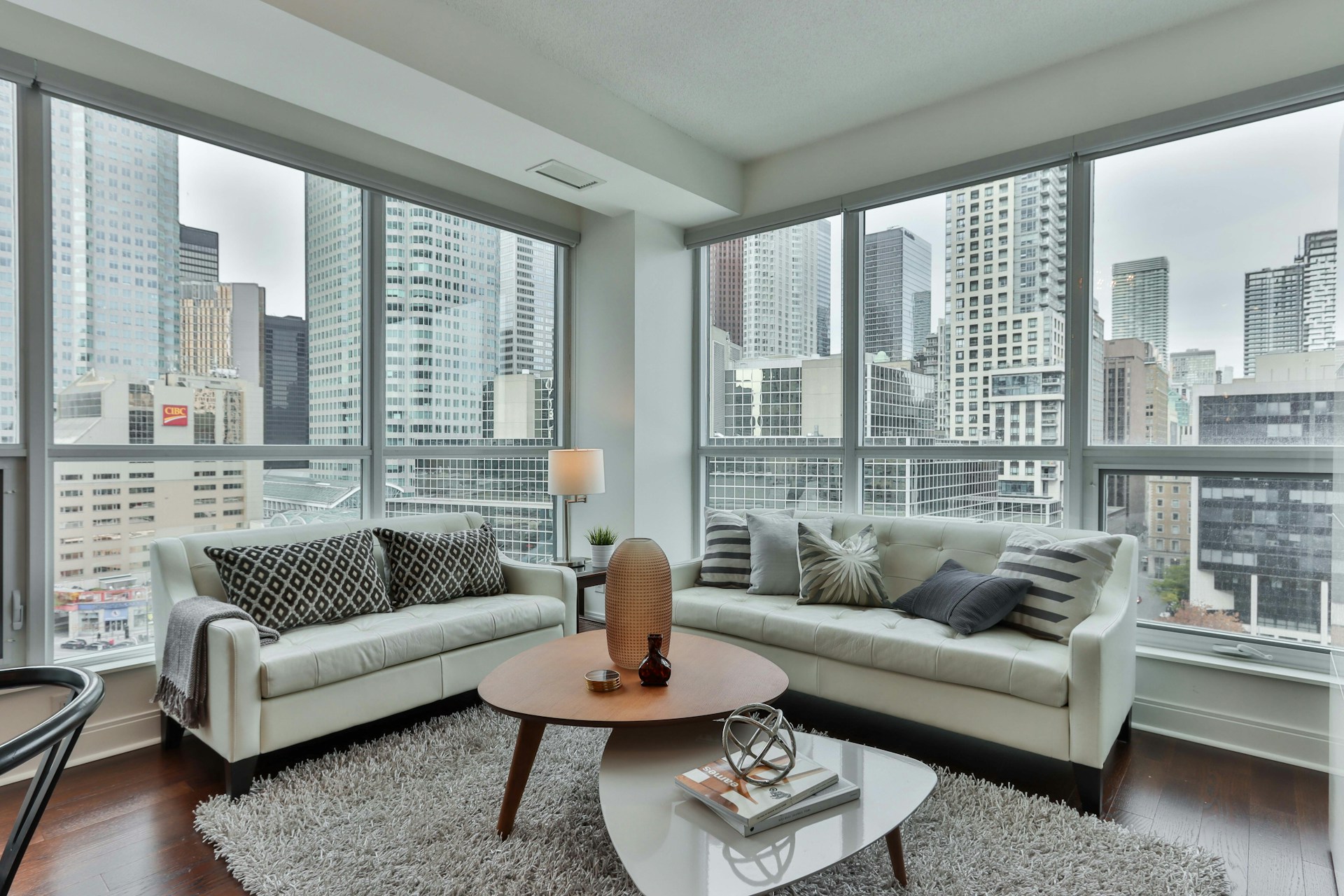gray couch and brown wooden round table