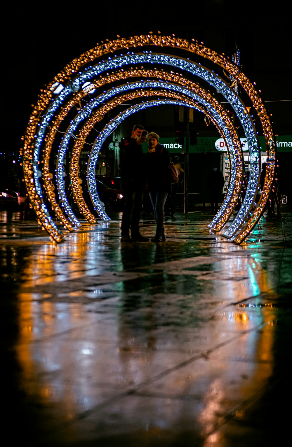 people walking on street with lights