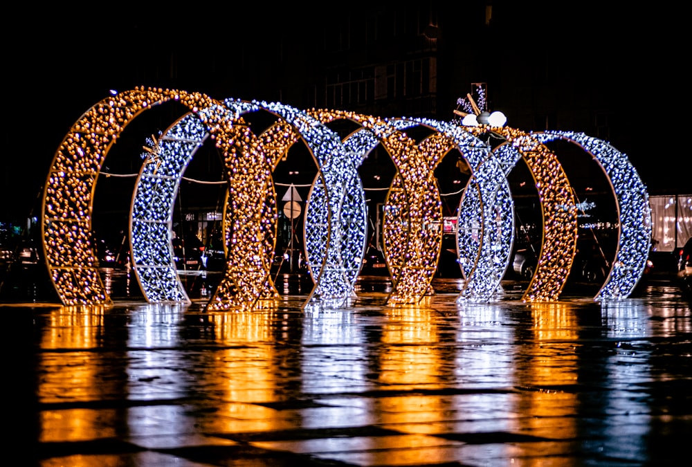 blue and white lights on bridge during night time