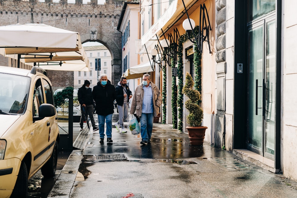 people walking on sidewalk during daytime