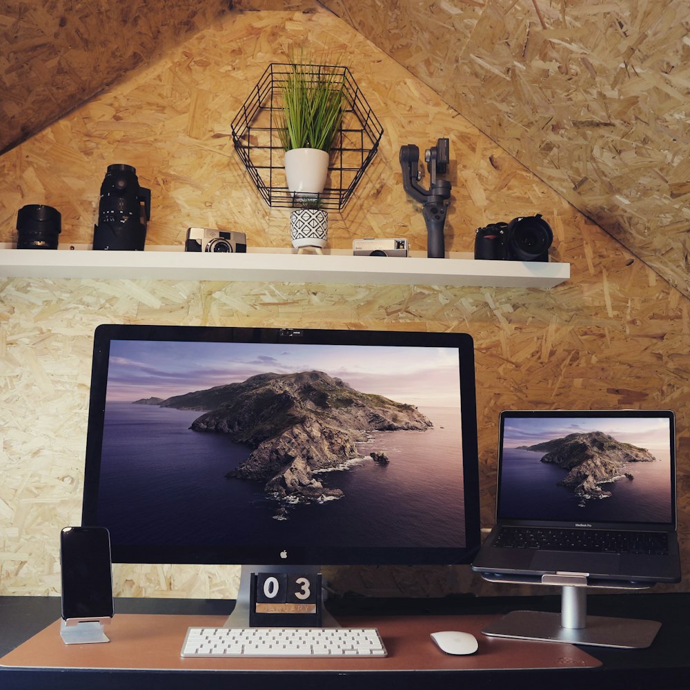 silver imac on white wooden table