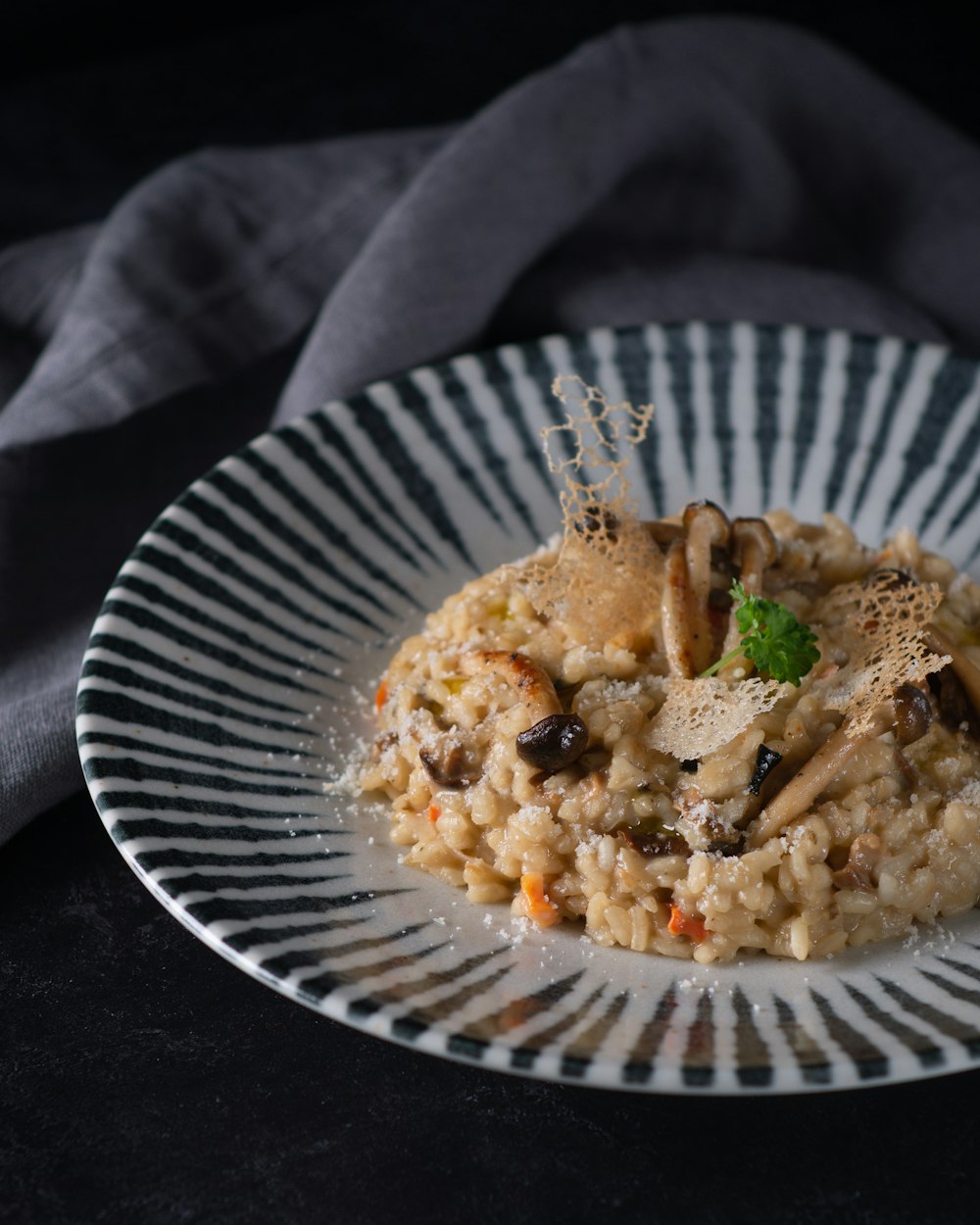 cooked rice with green vegetable on white round plate