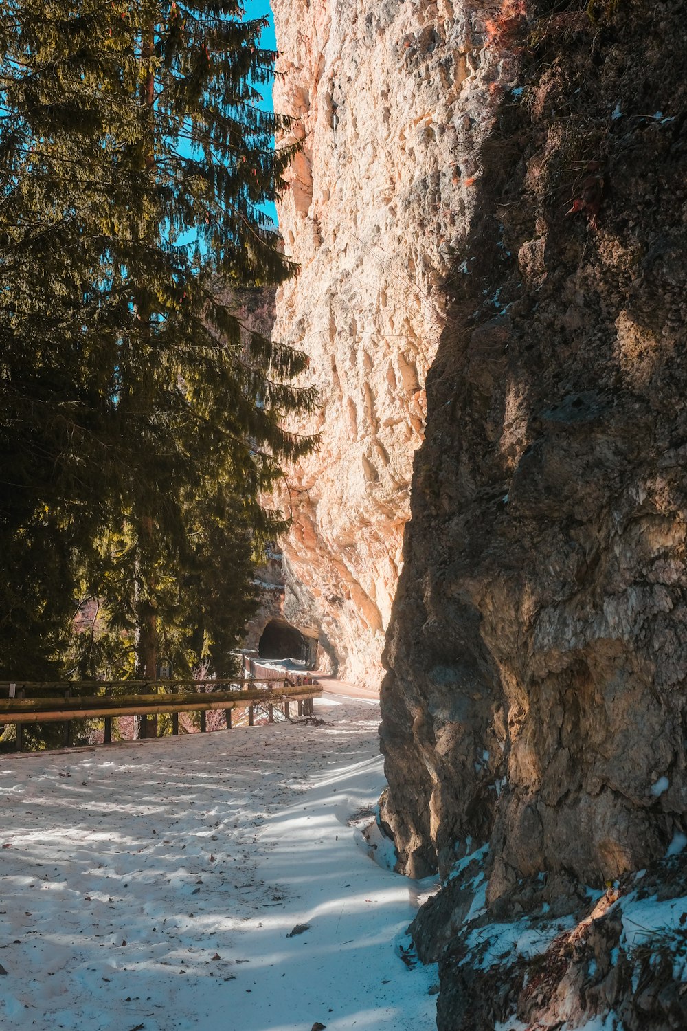 brown wooden bridge in the middle of brown rock formation