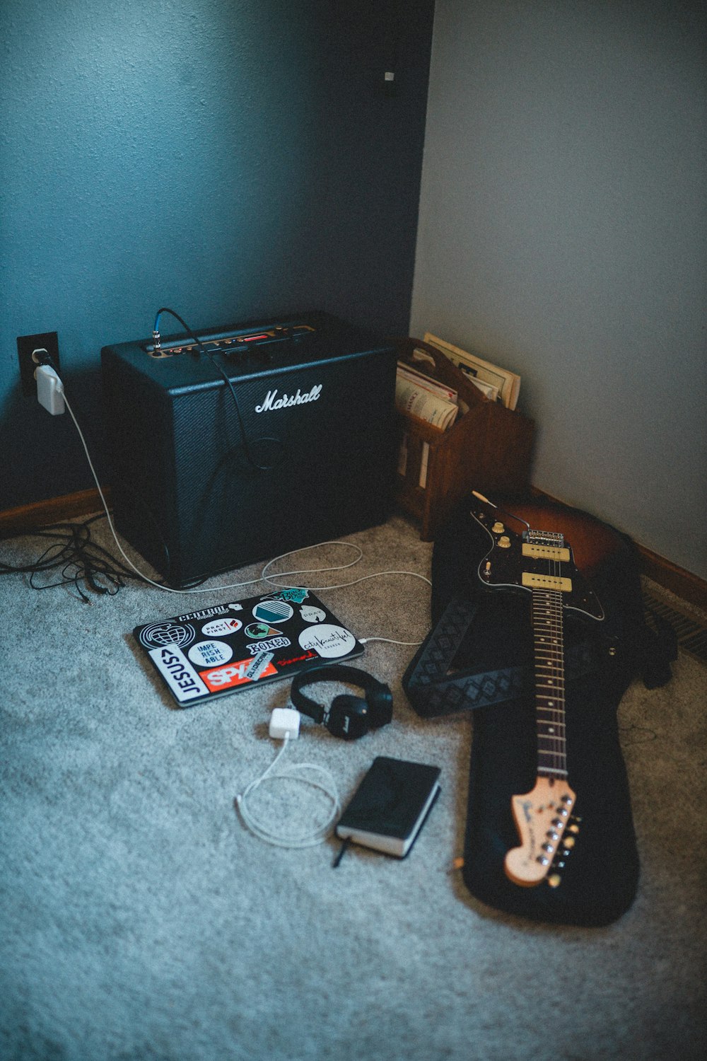 black guitar amplifier beside black and gray speaker