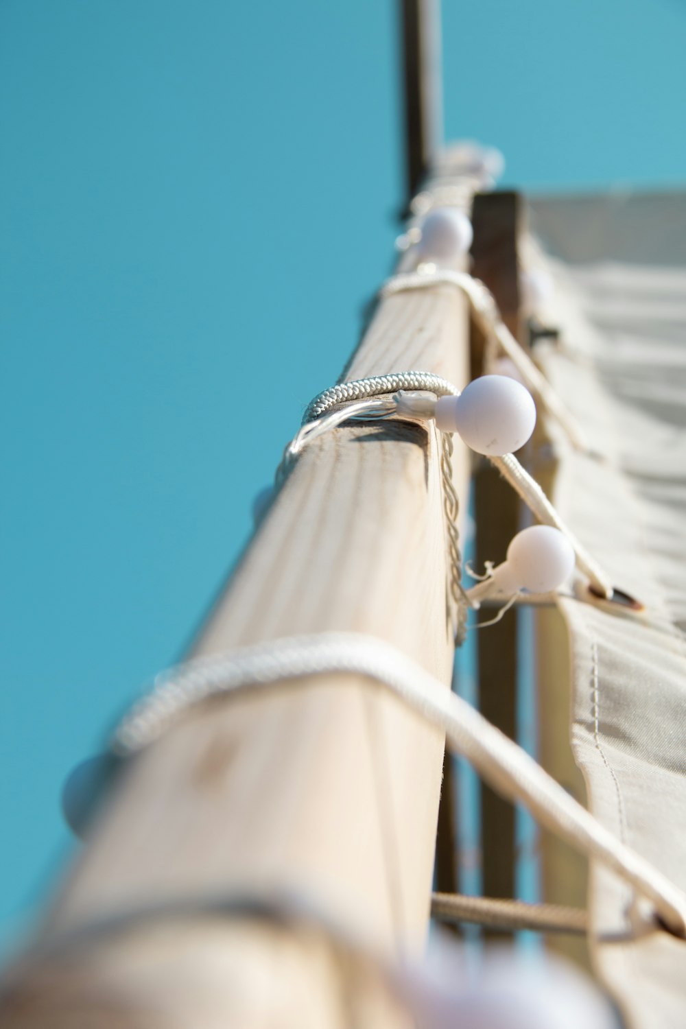 white string lights on brown wooden pole during daytime
