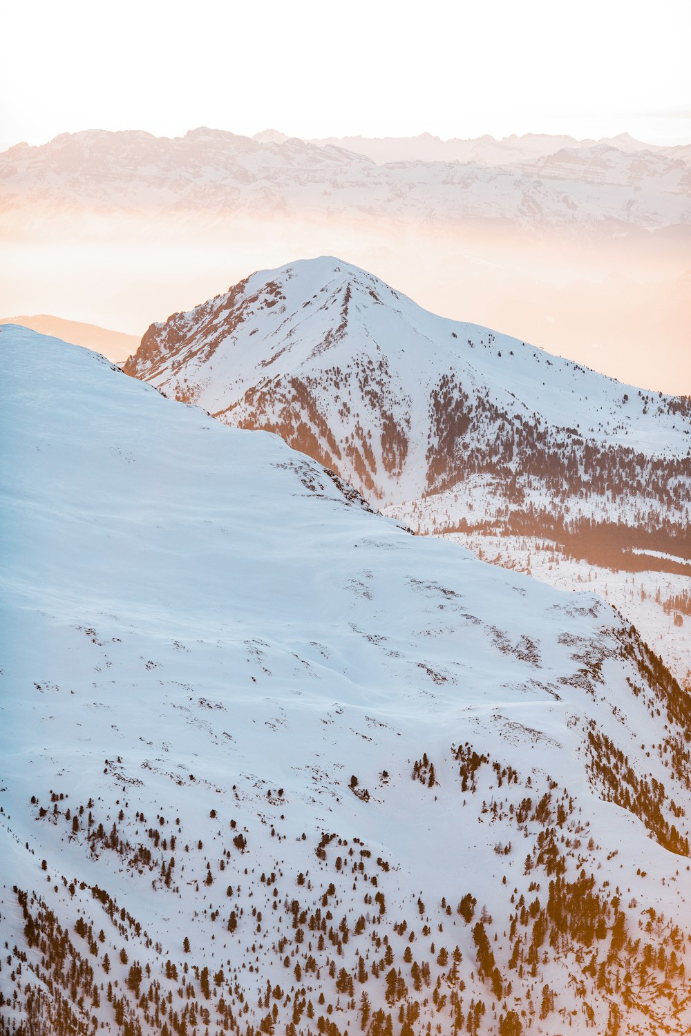 snow covered mountain during daytime