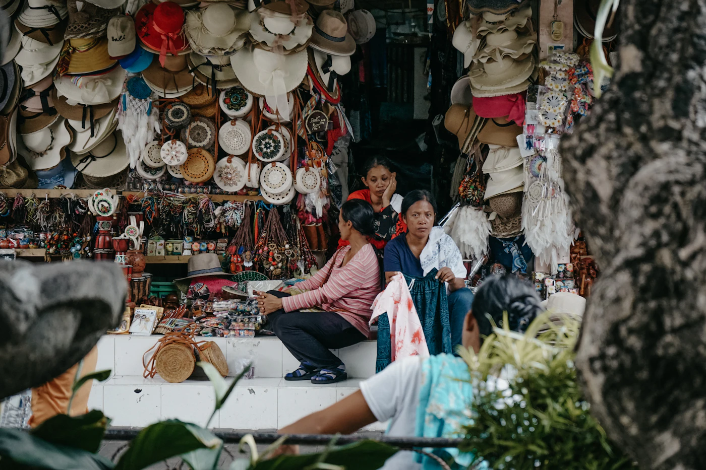 People browsing stalls at a busy Bali market