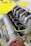 A close-up view of a high-performance engine, featuring multiple intake manifolds made of polished metal, partially unscrewed, revealing inner components. The engine has a sturdy, industrial design with a visible logo, set against a bright yellow background that highlights its mechanical complexity.