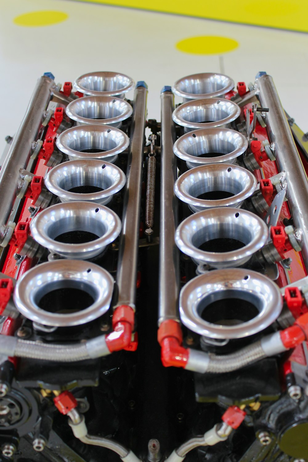 silver and red pipe on red and white metal rack