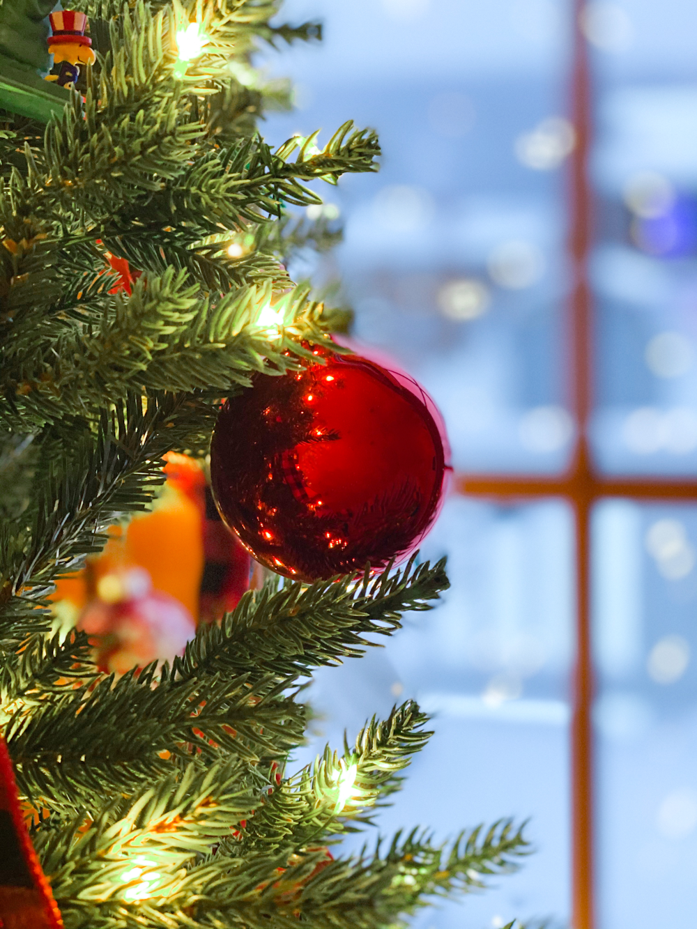 red baubles on green pine tree