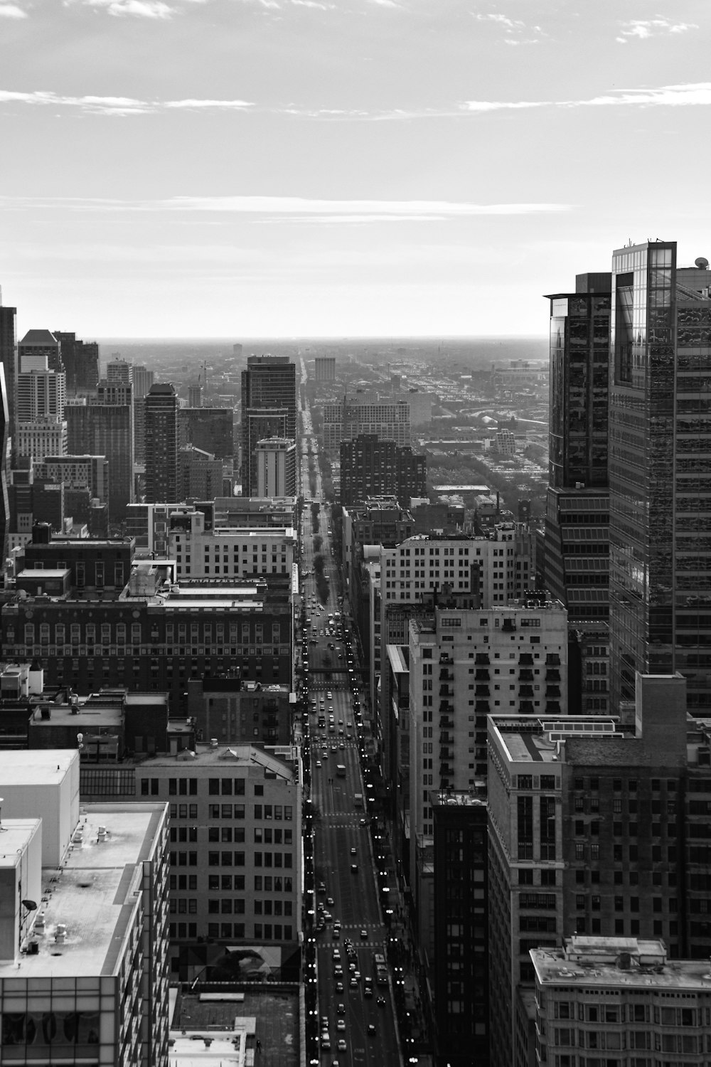 grayscale photo of city buildings