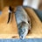 Close-up of fresh fish fillets on a rustic wooden board.