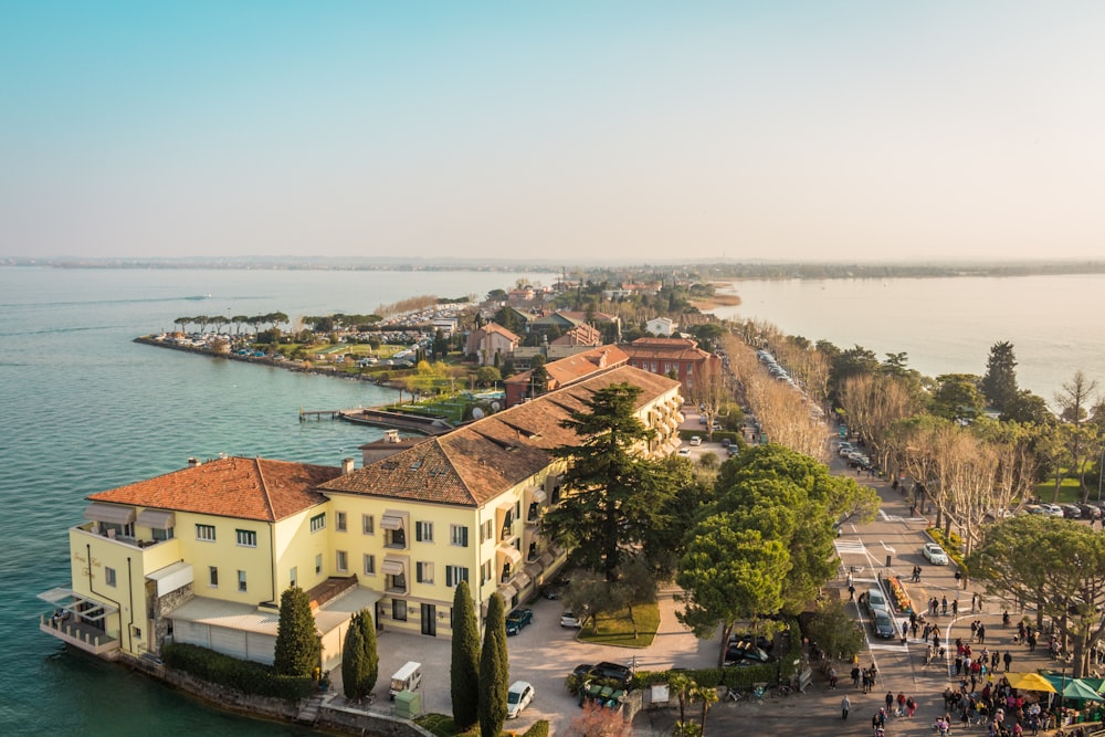 white and brown concrete buildings near body of water during daytime