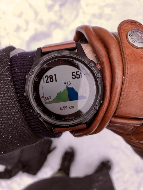 The Ski Watch displaying temperature and time during a sunny winter hike