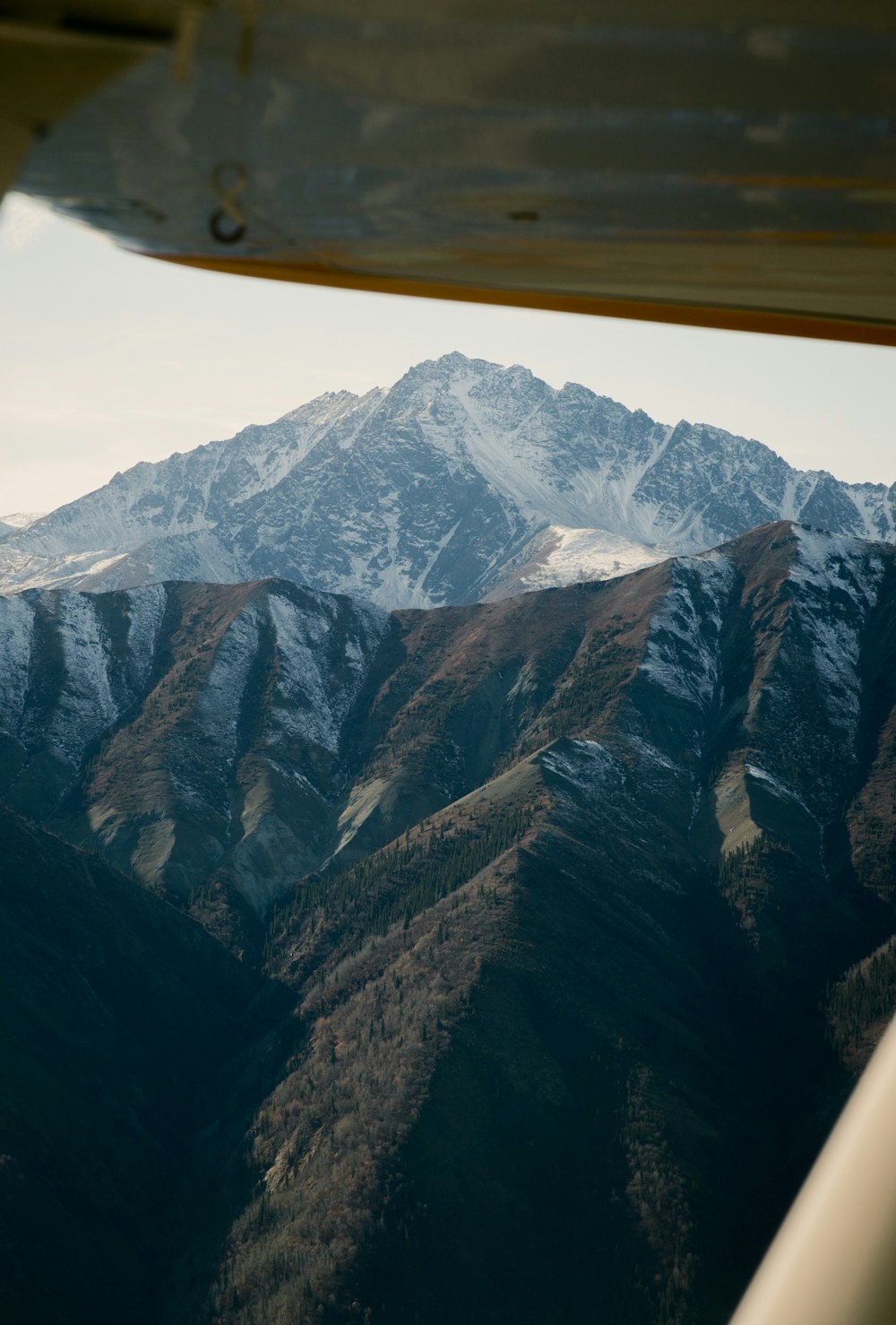 a view of a mountain range from an airplane