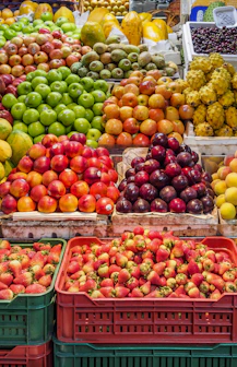 red and green apples on red plastic crate