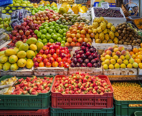 red and green apples on red plastic crate