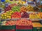 red and green apples on red plastic crate