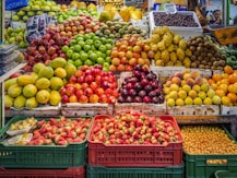 red and green apples on red plastic crate