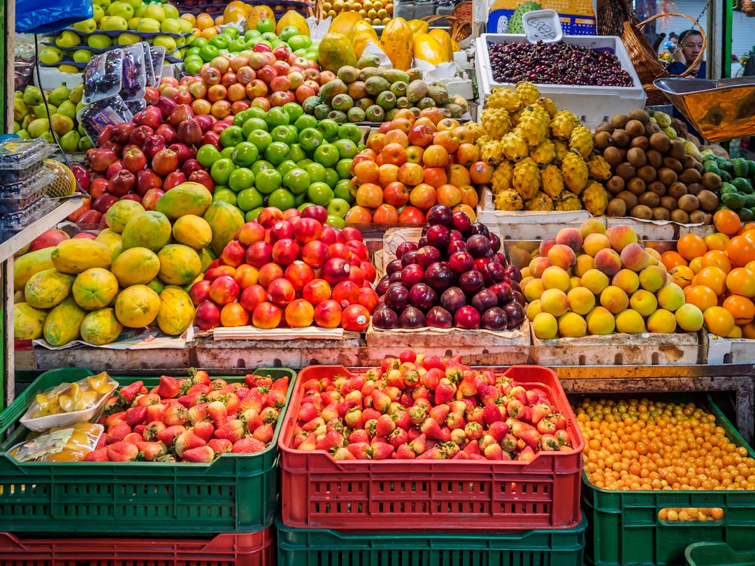 red and green apples on red plastic crate