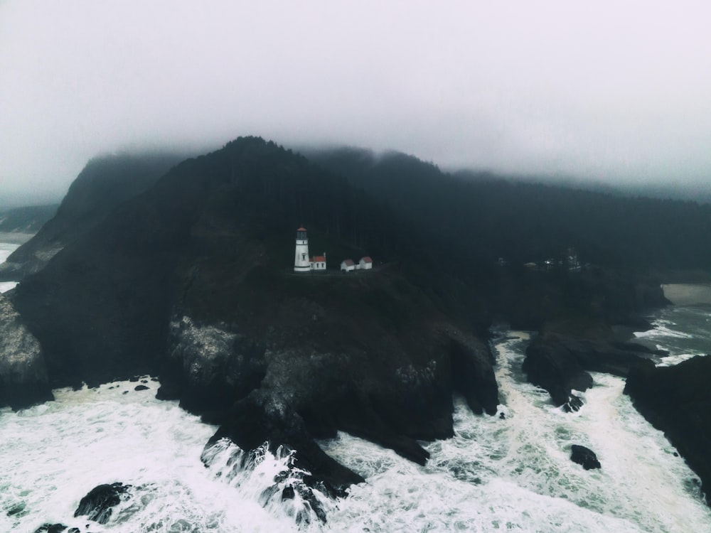 white and brown house on top of mountain