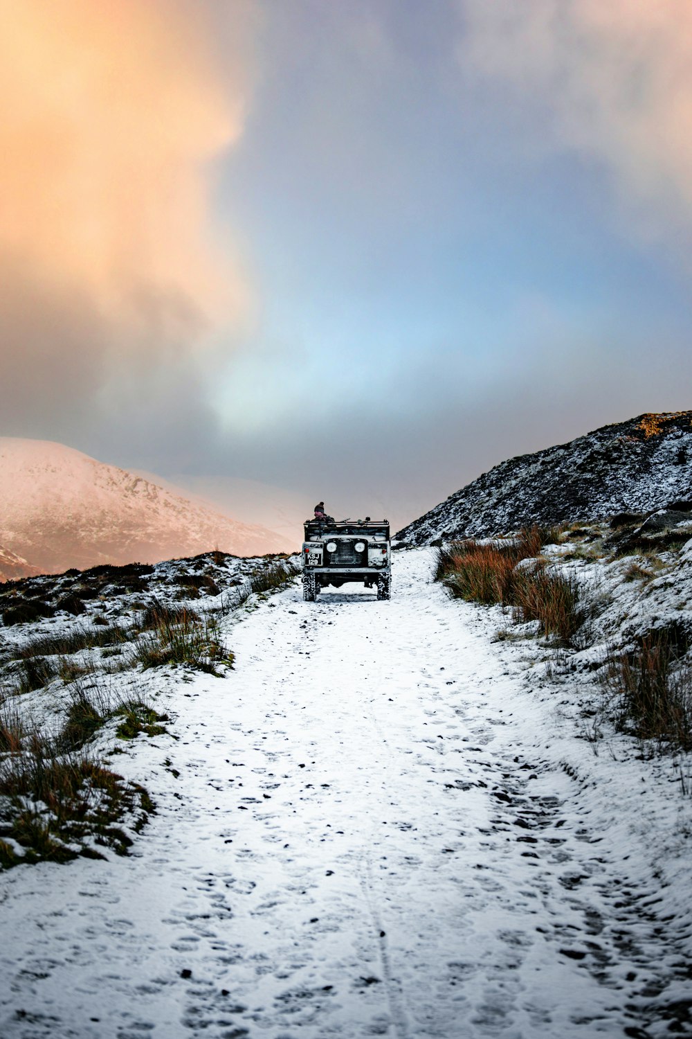 black house on snow covered ground