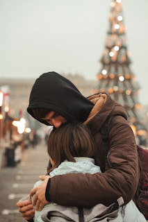 woman in brown leather jacket and black knit cap