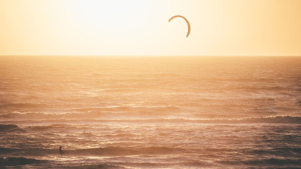 person surfing on sea during daytime