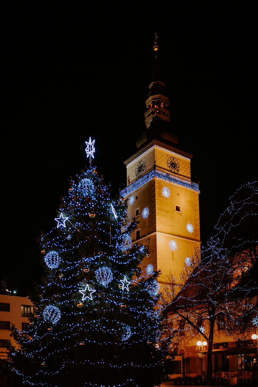 brown concrete tower with lights during night time