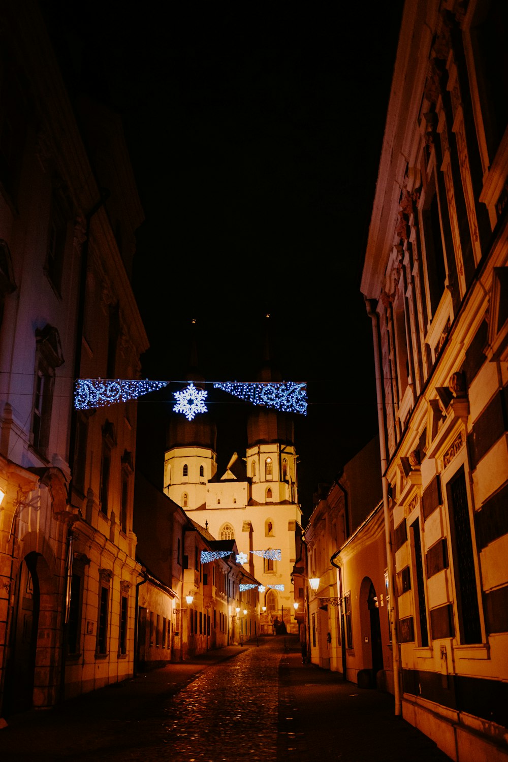 brown concrete building with star on top during night time