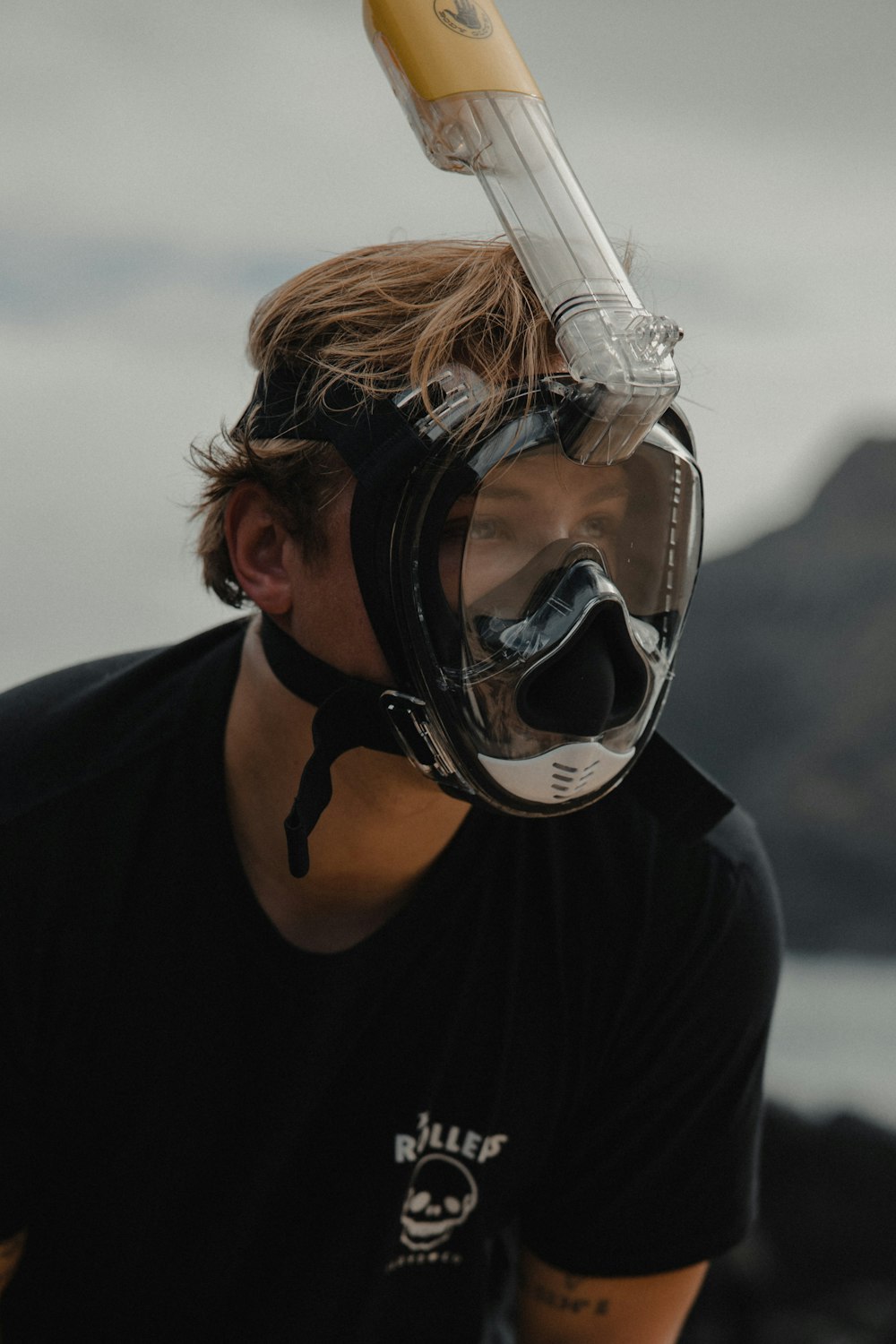 woman in black long sleeve shirt wearing white and black goggles