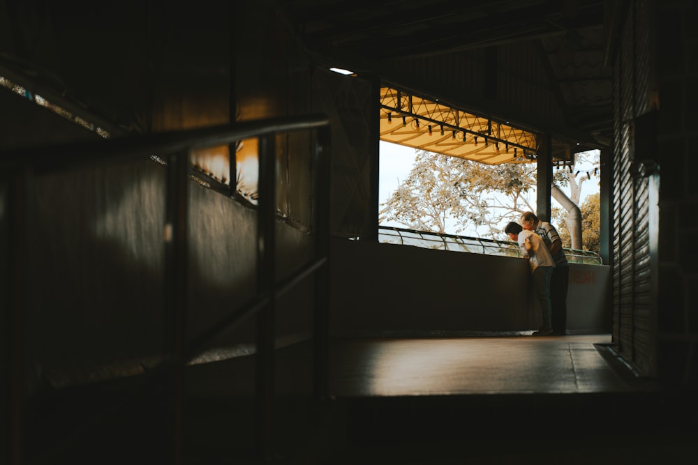 man and woman sitting on bench