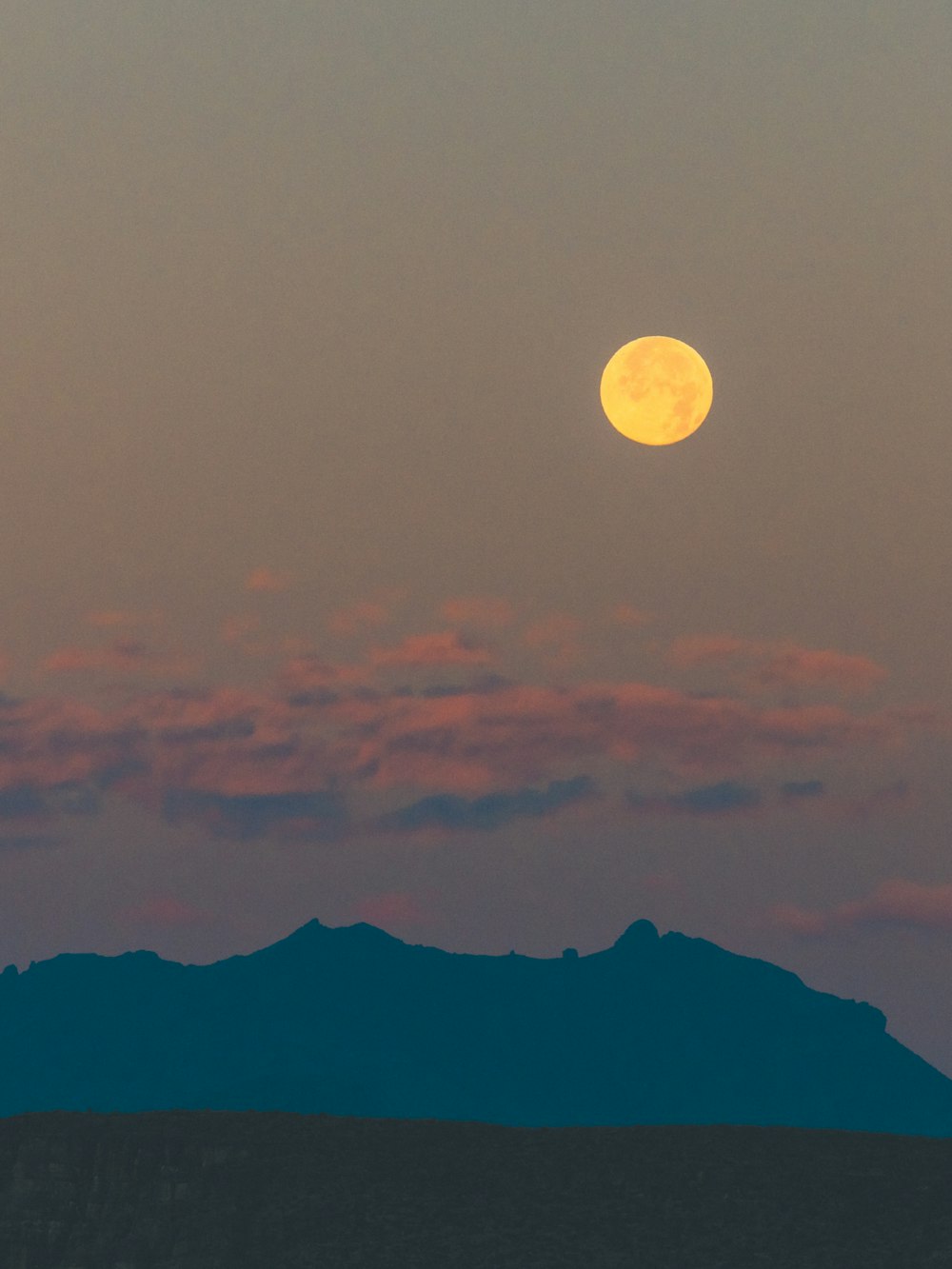 silhouette of mountain during night time