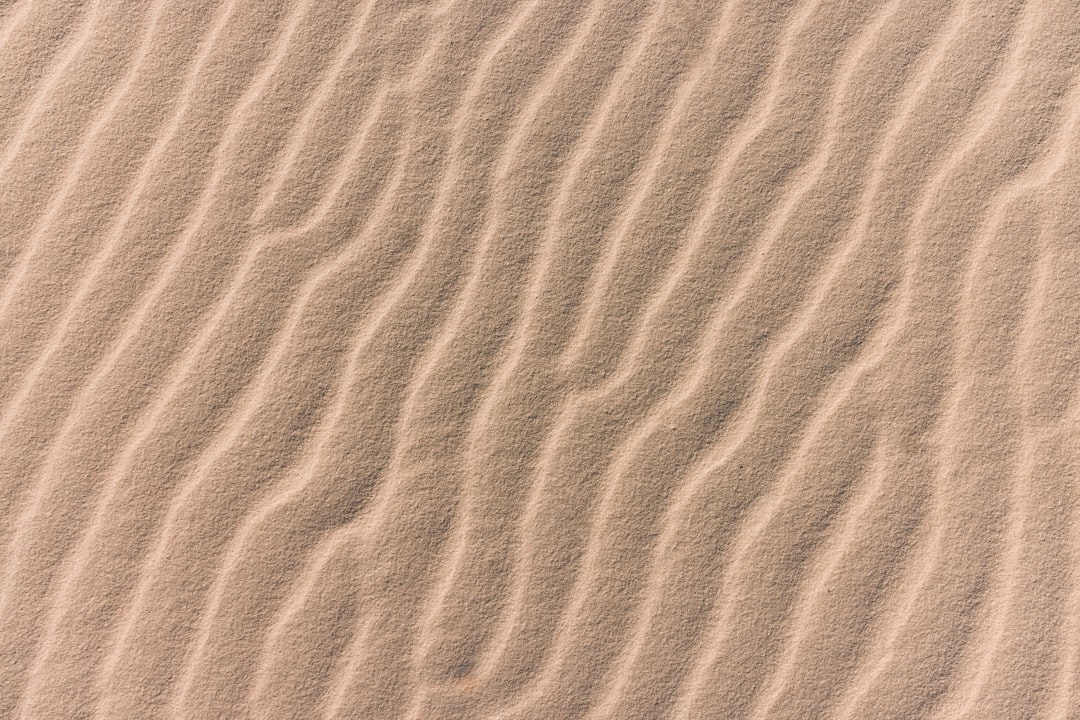 brown sand with shadow of person