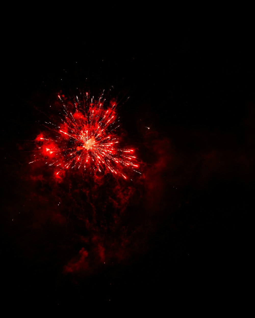 red fireworks in the sky during night time