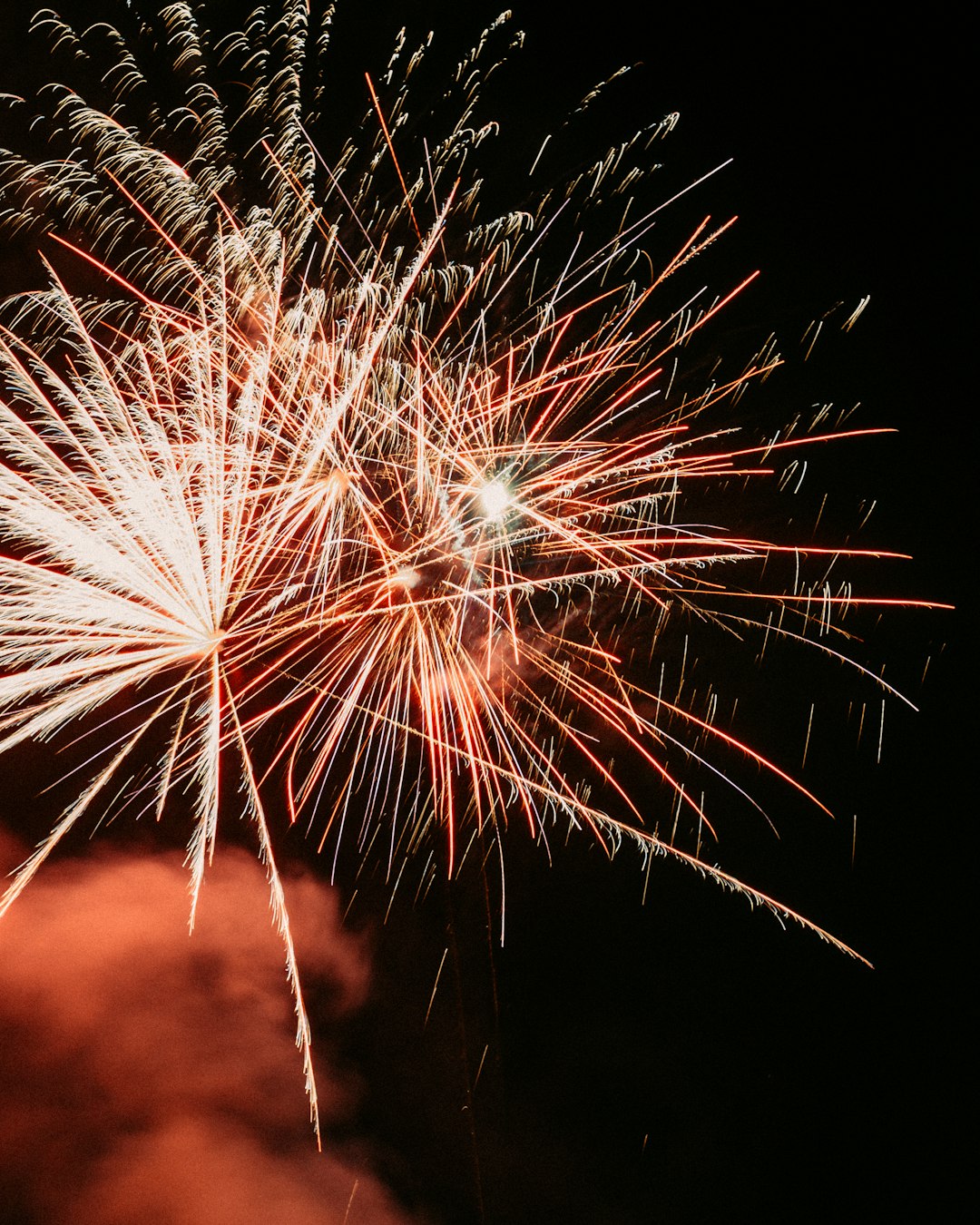 white and red fireworks during nighttime