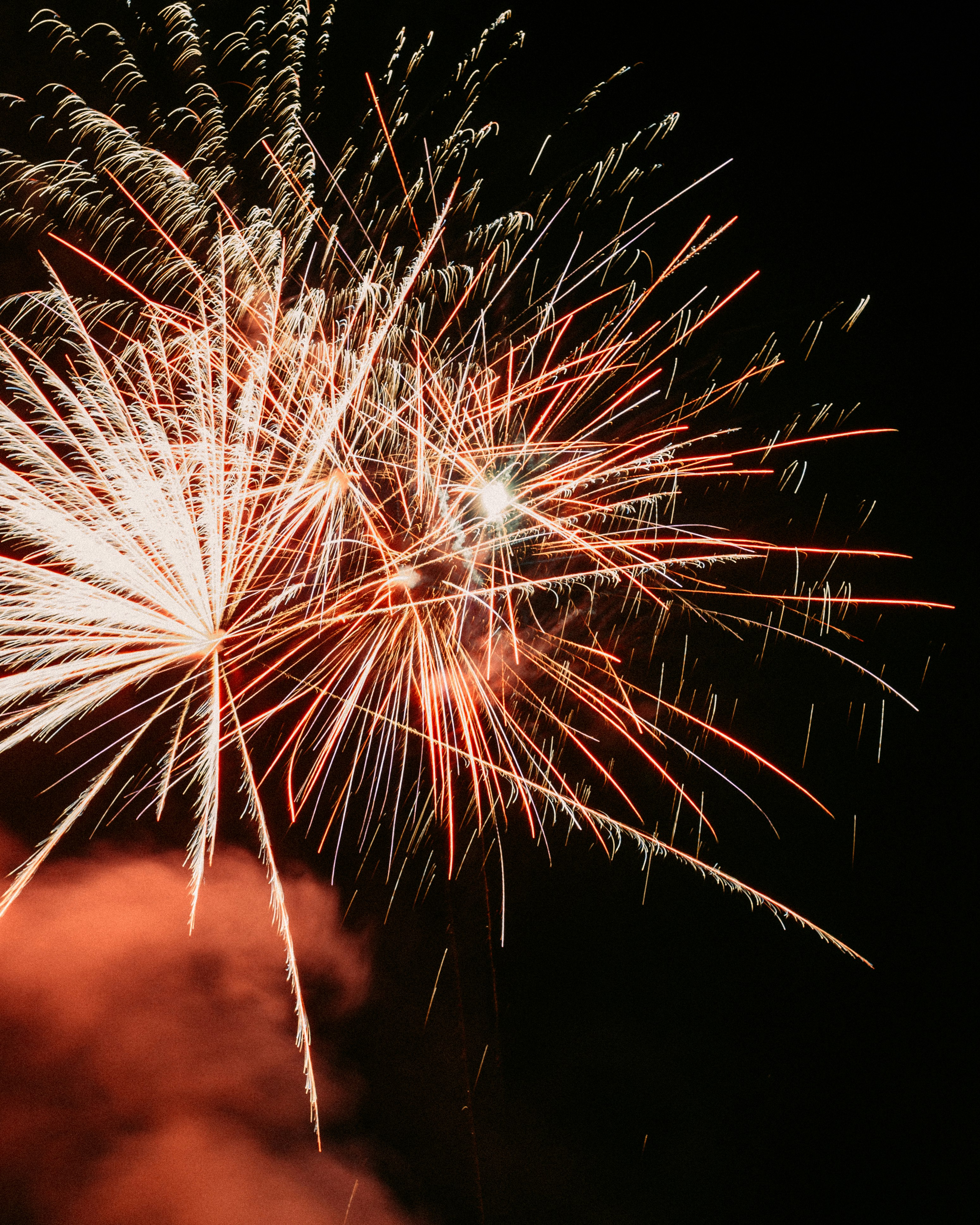 white and red fireworks during nighttime