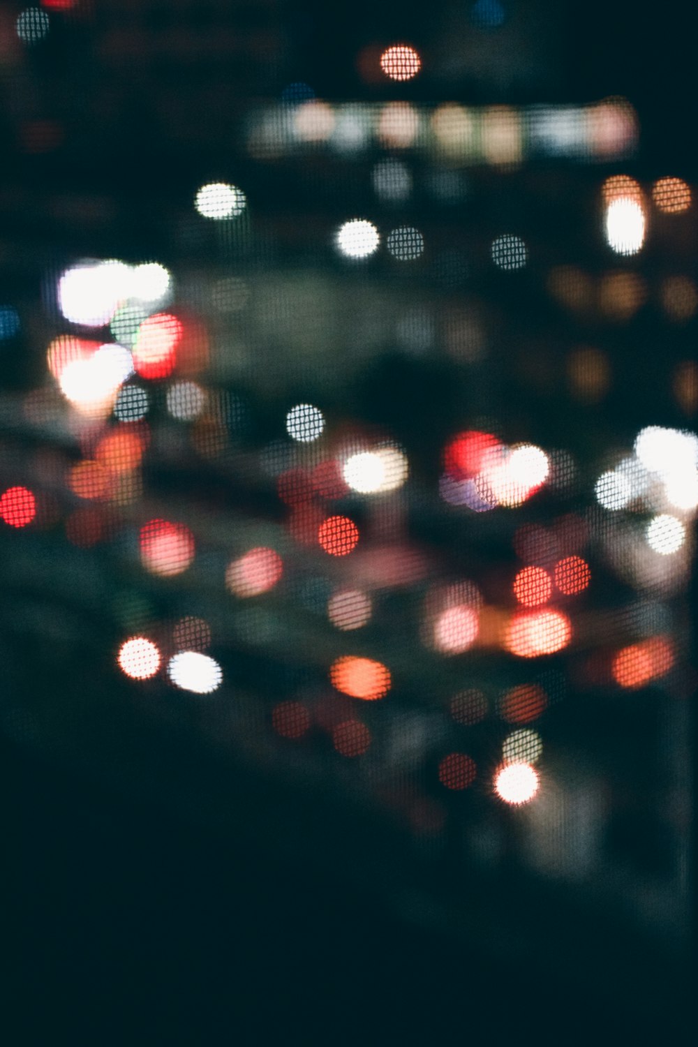 water droplets on glass window during night time