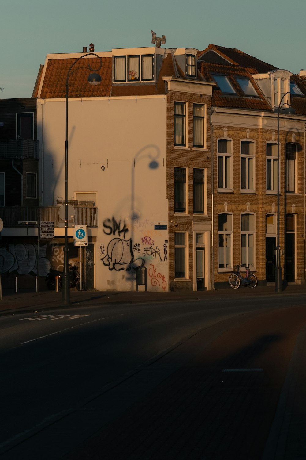 brown concrete building beside road during daytime