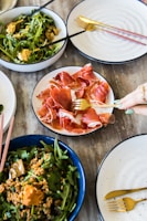 Close-up of traditional Piedmontese cuisine served on rustic wooden table.