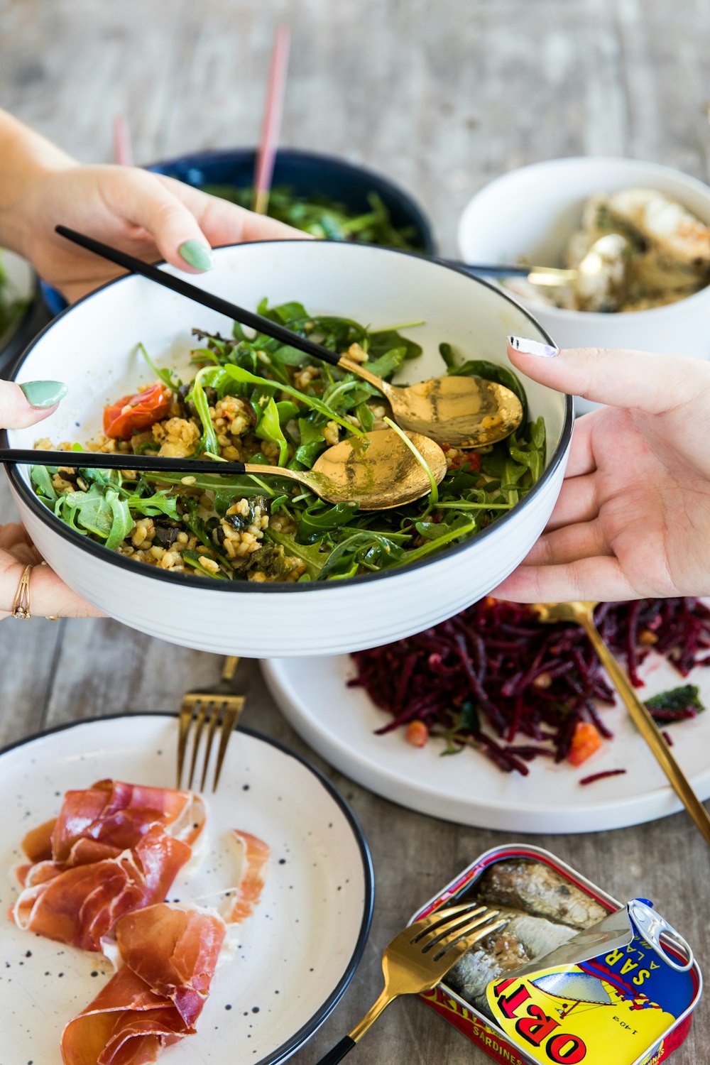 person holding white ceramic bowl with vegetable dish