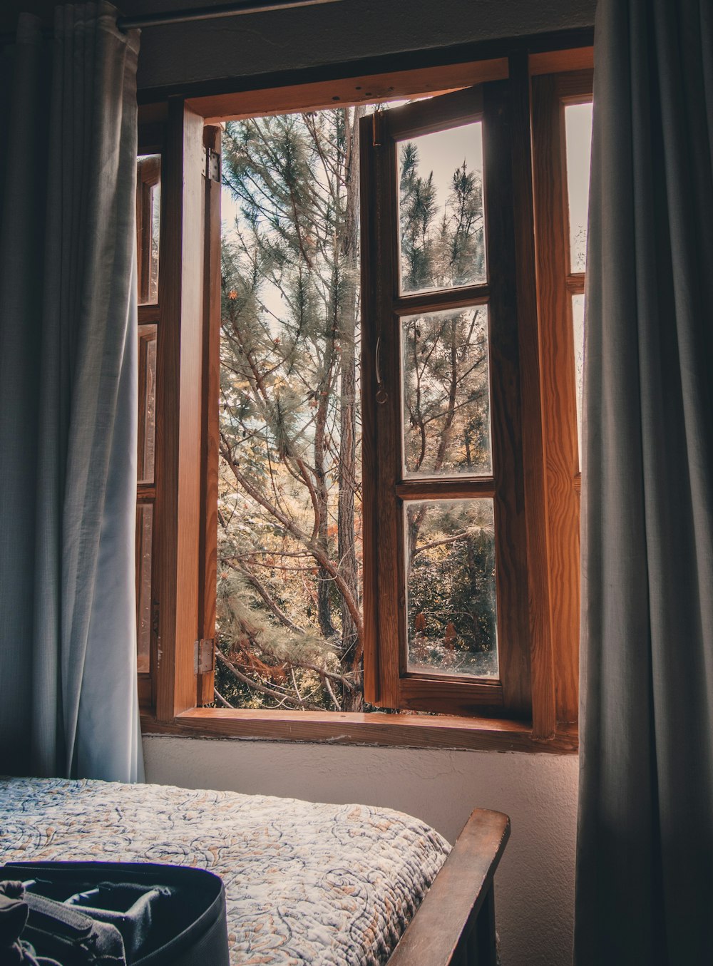 white window curtain near white wooden framed glass window