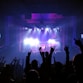 people standing on stage with lights