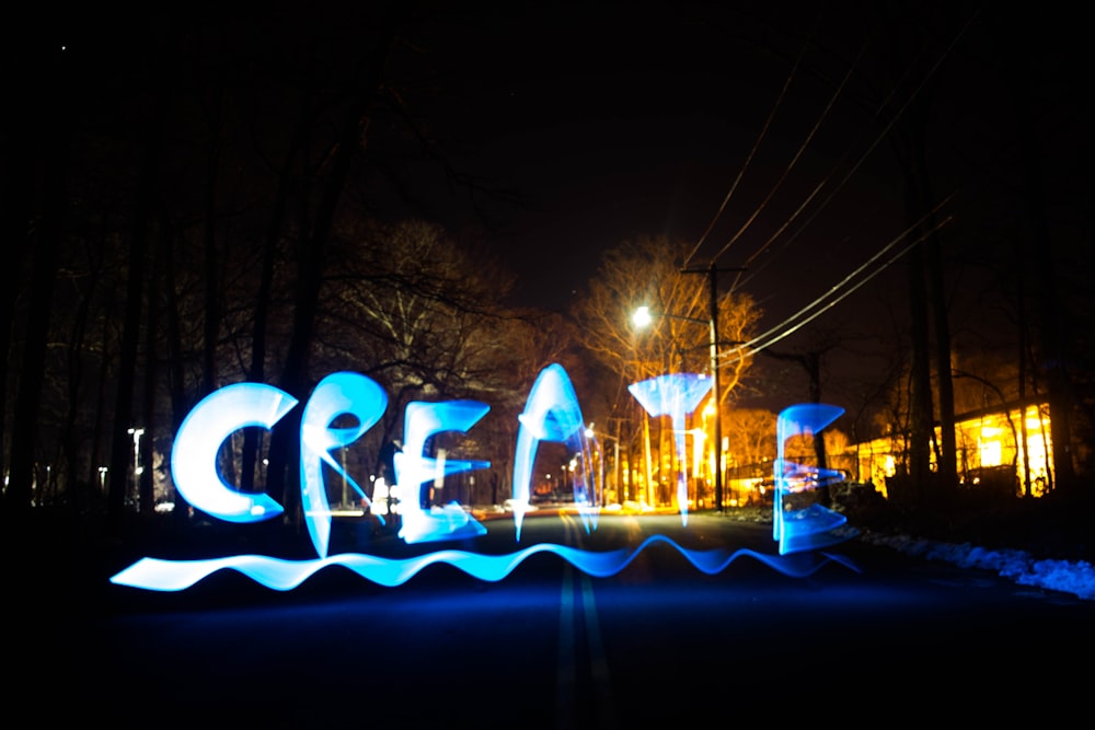 blue and white lighted light during night time