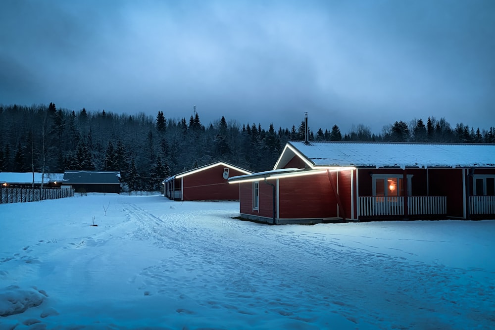 brown wooden house on snow covered ground