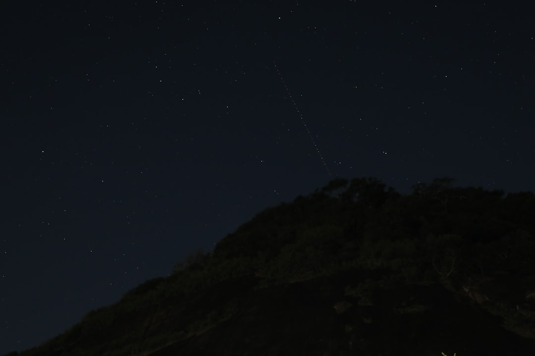 black mountain under blue sky during night time